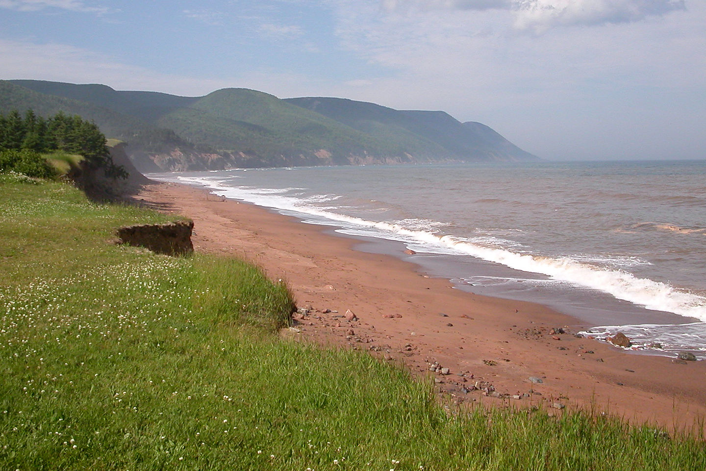 Red sand beach on Aspy Bay Red sand beach on Aspy Bay