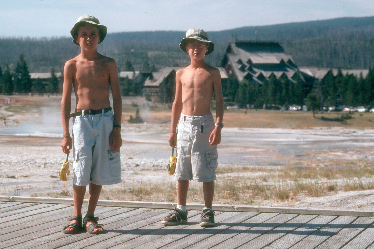 Boys on boardwalk by Old Faithful Inn Boys on boardwalk by Old Faithful Inn