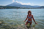 Lolo frolicking in Lake Lucerne with Mt. Pilatus peeking Lolo frolicking in Lake Lucerne with Mt. Pilatus peeking