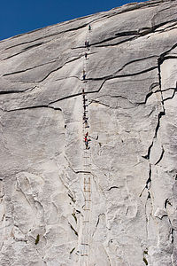 Half Dome cables with climbing tourists