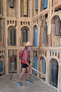 Striking the bells in the pavilion beneath The Man